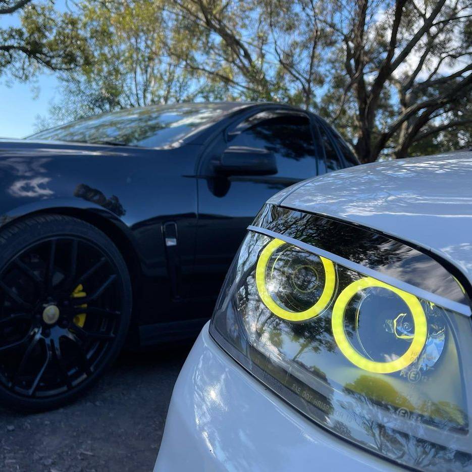 Holden VE Series 2 Black DRL Headlights with yellow LED angel eye halo lights by Spectrum