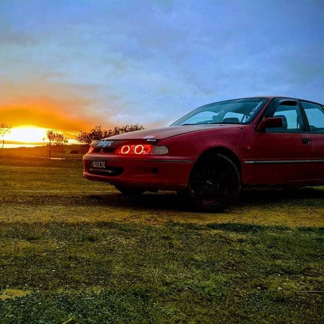 Holden VS Headlights with red LED angel eye halo lights by Spectrum