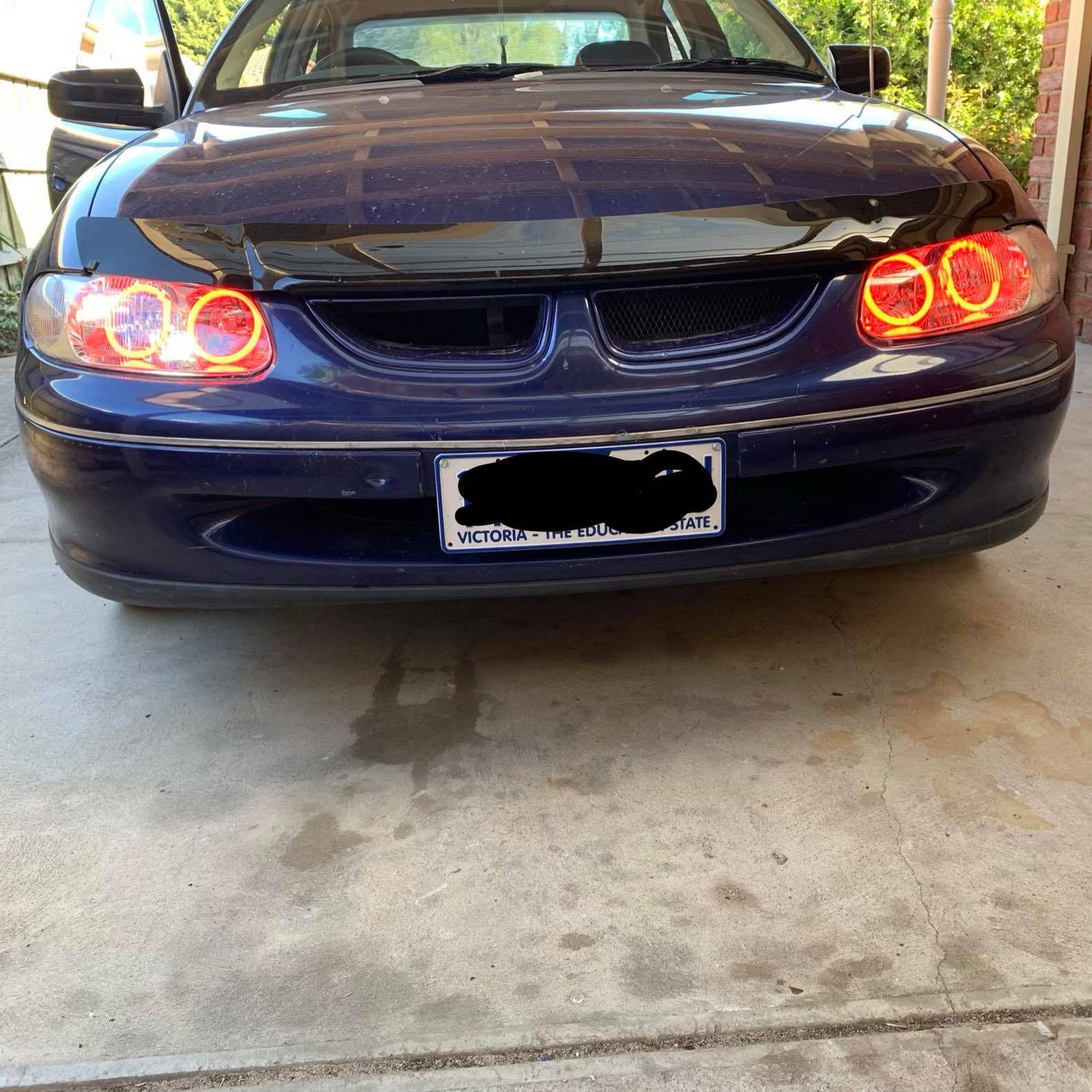 Holden VT Headlights with red LED angel eye halo lights by Spectrum