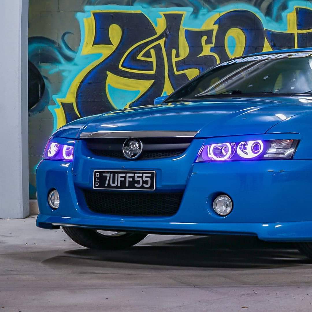 Holden VZ Headlights with purple LED angel eye halo lights by Spectrum