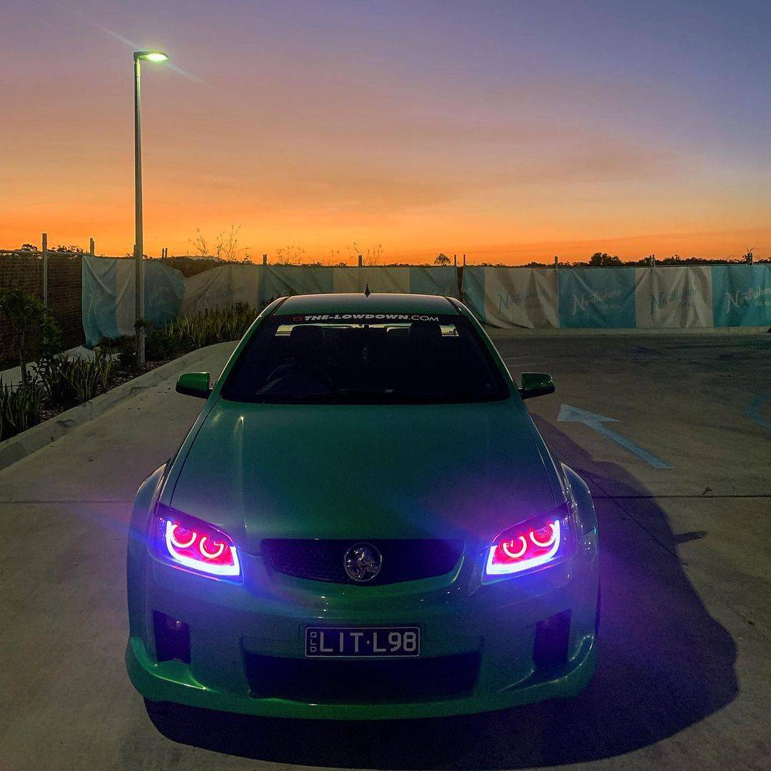 Holden VE Series 1 Black DRL Headlights with red LED angel eye halo lights by Spectrum