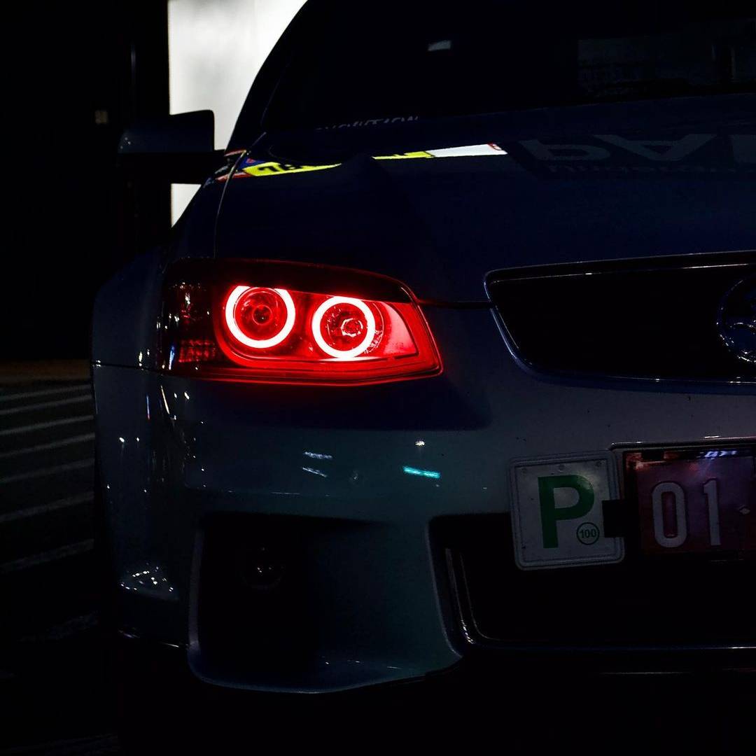 Holden VE Series 2 Black DRL Headlights with red LED angel eye halo lights by Spectrum