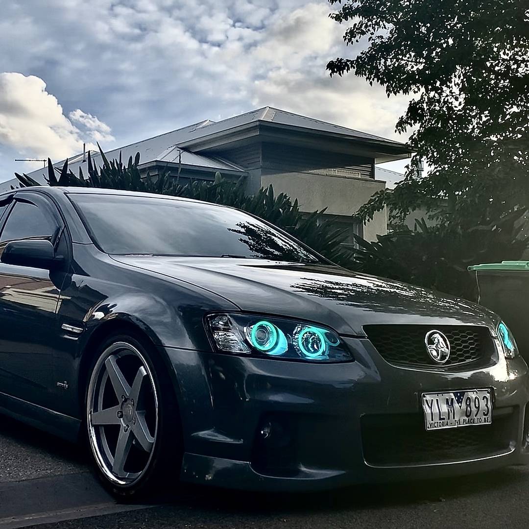 Holden VE Series 2 Headlights with cyan LED angel eye halo lights by Spectrum