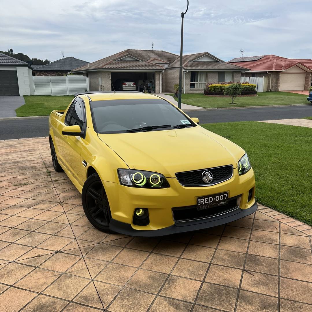 Holden VE Series 2 Headlights with yellow LED angel eye halo lights by Spectrum