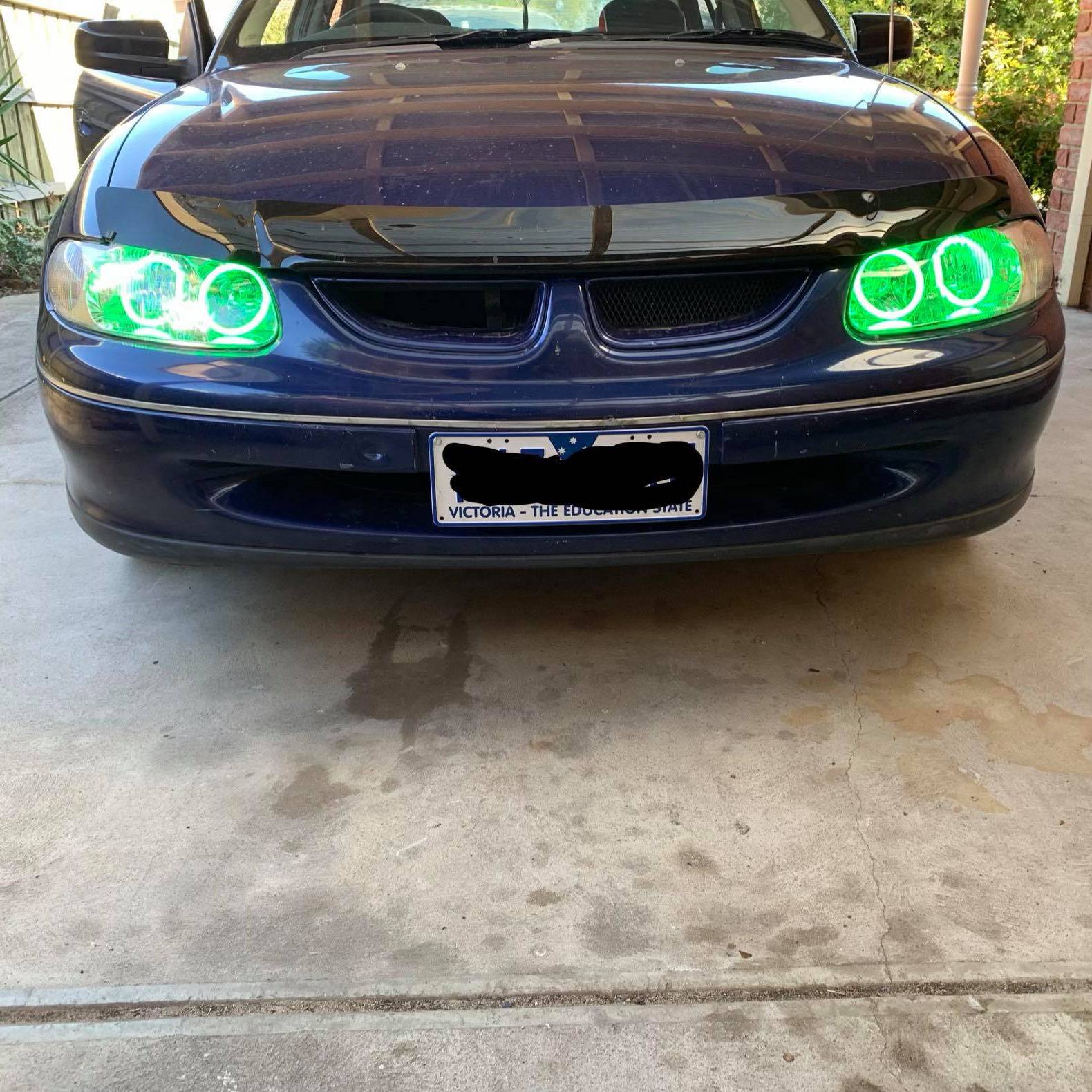 Holden VT Headlights with green LED angel eye halo lights by Spectrum
