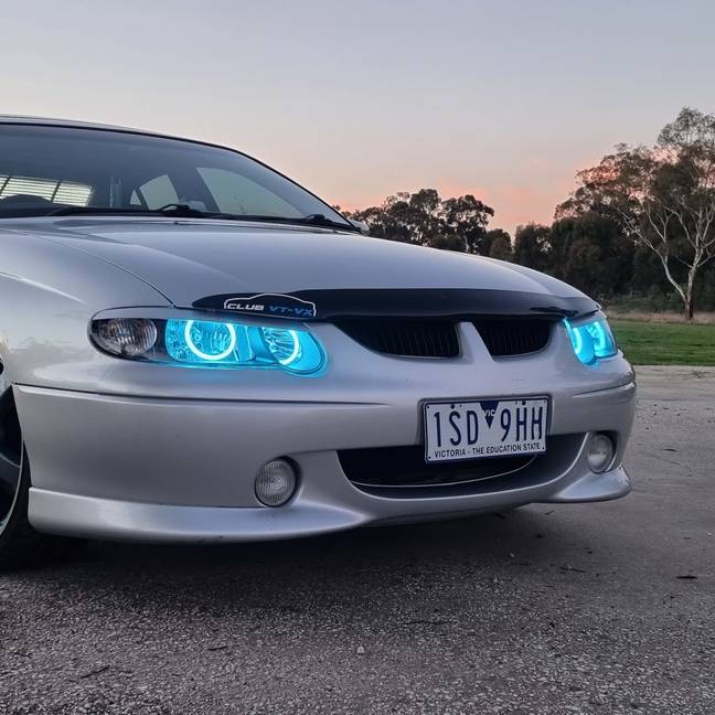 Holden VX Headlights with cyan LED angel eye halo lights by Spectrum