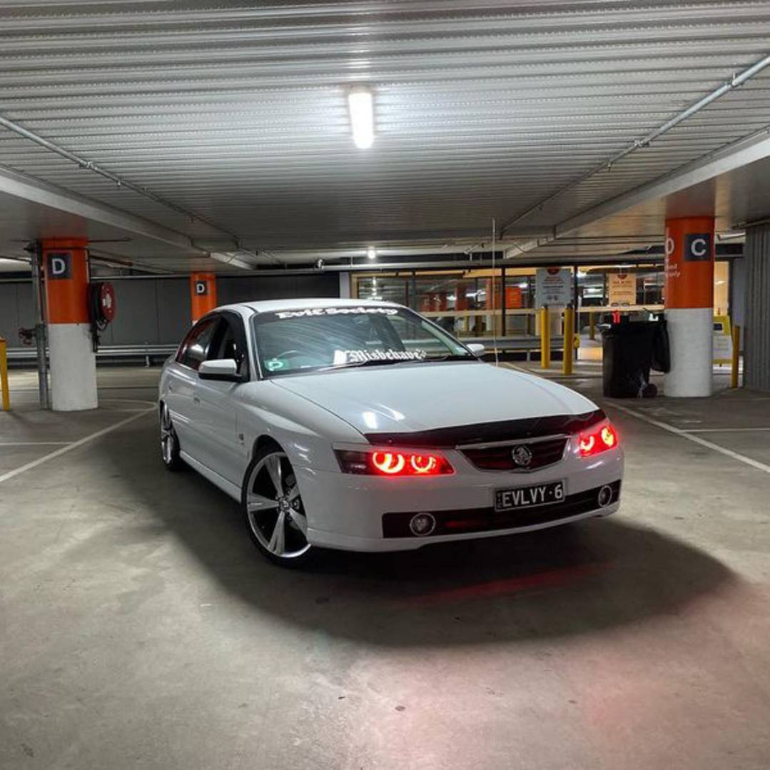 Holden VY Berlina/Calais/HSV Headlights with red LED angel eye halo lights by Spectrum