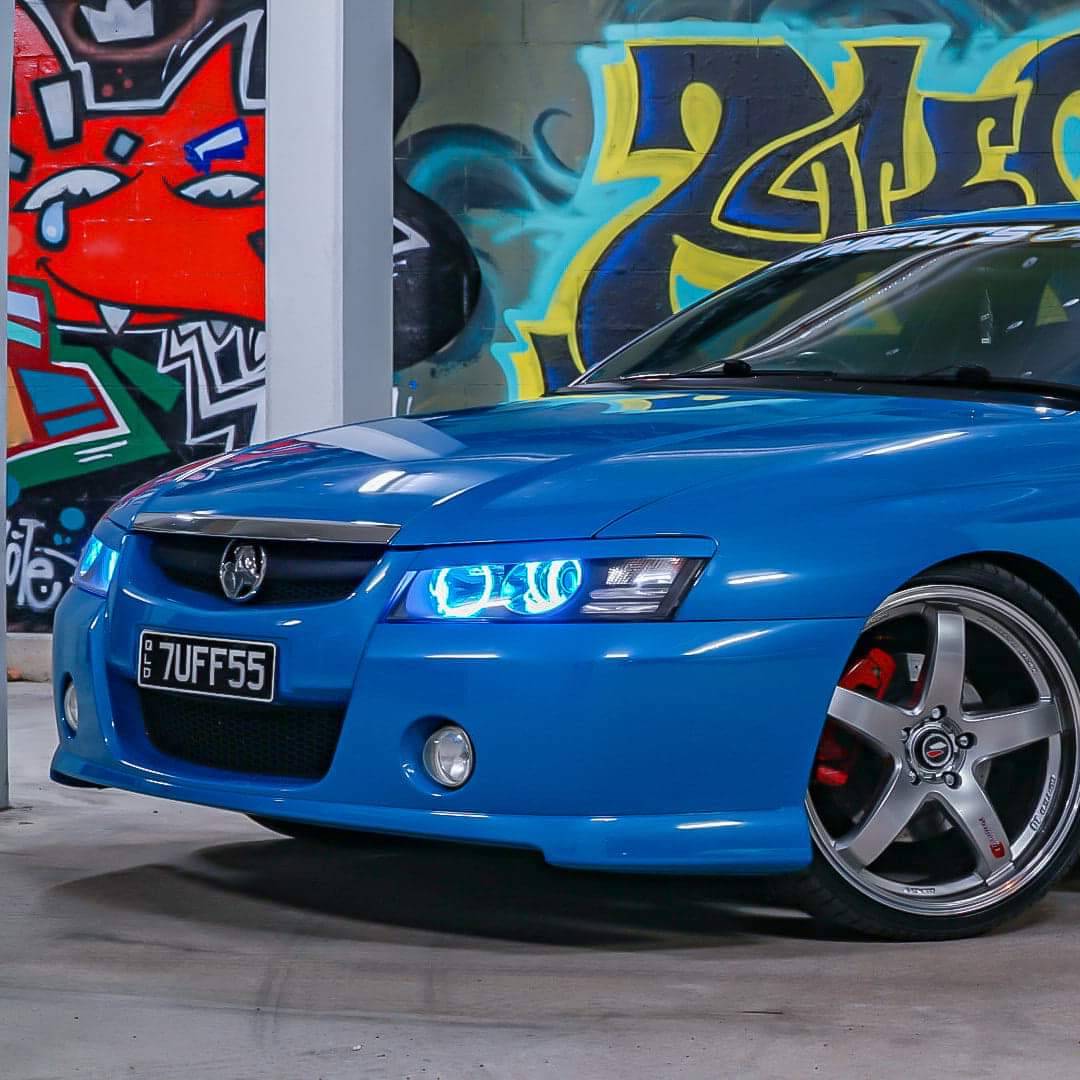 Holden VZ Headlights with cyan LED angel eye halo lights by Spectrum